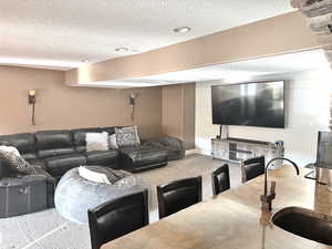 Exercise area featuring baseboards and a sauna