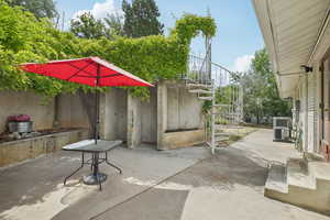 View of patio featuring stairs