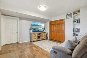 MIL - Living room with wood finished floors