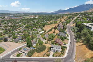 View of property location with a mountainous background and nearby suburban area