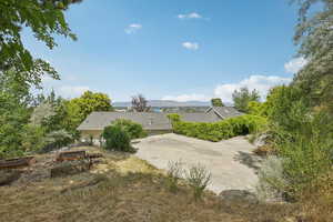 View of yard featuring a vegetable garden and a mountain view