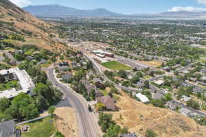 View of property location with a mountain backdrop and nearby suburban area