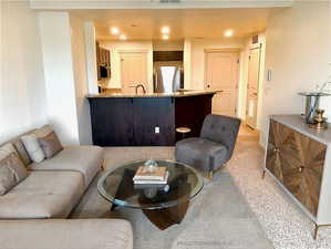 Living room featuring recessed lighting and light carpet