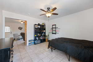 Bedroom featuring light tile patterned flooring and a ceiling fan