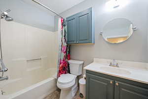 Bathroom with shower / tub combo and vanity