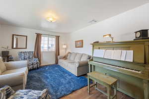 Living room featuring wood finished floors and baseboards
