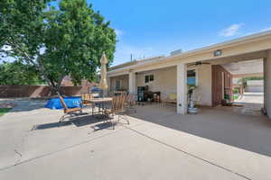 View of patio featuring ceiling fan and outdoor dining area