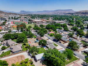 Aerial perspective of suburban area with a mountain backdrop