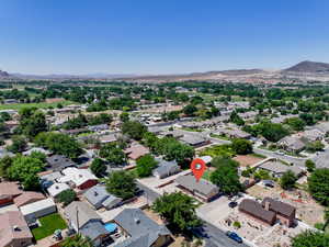 Aerial view of residential area featuring a mountain backdrop