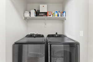 Laundry area with washer and clothes dryer