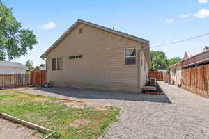 Back of property with a fenced backyard and a patio area
