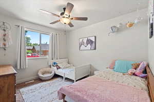 Bedroom featuring a ceiling fan and carpet flooring