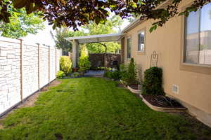 Fenced backyard featuring a patio area