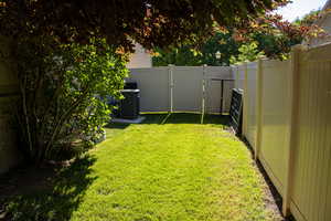 View of yard featuring a gate