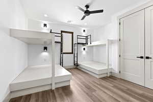 Unfurnished bedroom with light wood finished floors and recessed lighting
