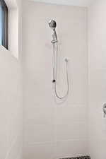 Full bath with a tile shower