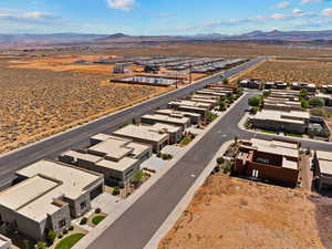 Aerial perspective of suburban area featuring a mountainous background