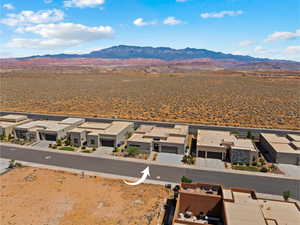 Aerial perspective of suburban area featuring a mountainous background