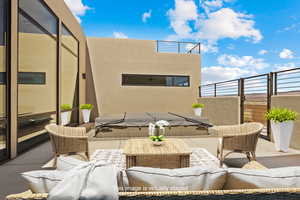 View of patio with an outdoor living space