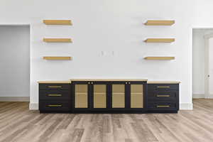 Detailed view of wood finished floors and baseboards