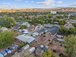 Aerial perspective of suburban area featuring a mountain backdrop