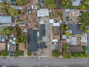 Aerial view of property and surrounding area with nearby suburban area