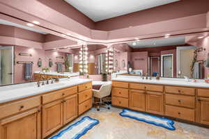 Full bath with vanity and recessed lighting