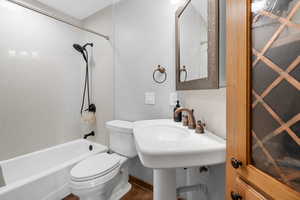 Full bath featuring shower / tub combination and tile patterned floors