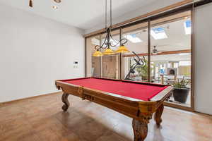 Game room featuring a skylight and billiards