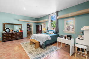 Tiled bedroom with recessed lighting