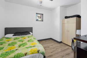 Bedroom featuring light wood-type flooring and ceiling fan