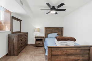 Bedroom with baseboards and a ceiling fan