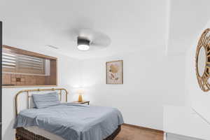 Bedroom with a ceiling fan and baseboards