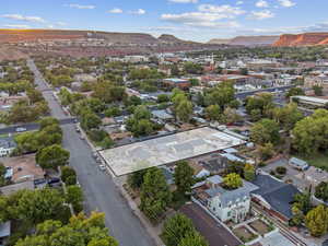 Aerial perspective of suburban area with a mountainous background