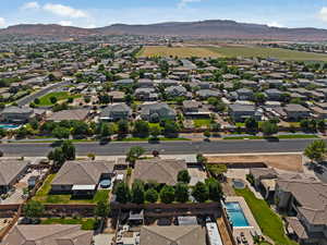 Aerial perspective of suburban area featuring a mountain backdrop