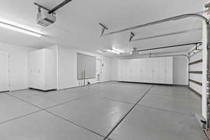 Garage featuring a garage door opener