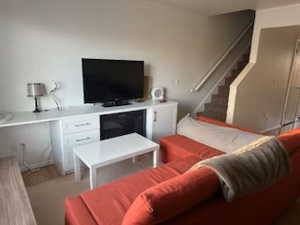 Living area featuring stairway