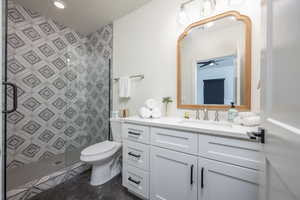 Bathroom featuring vanity and a stall shower