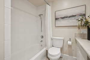 Full bathroom with shower / bath combo and vanity
