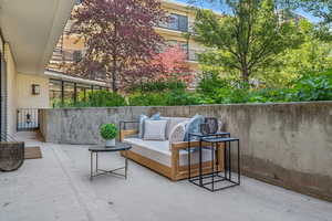 View of patio with an outdoor hangout area