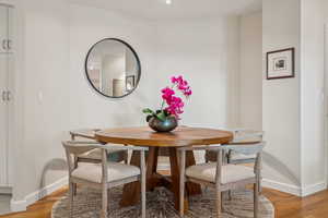 Dining room featuring baseboards and light wood finished floors