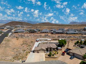 Aerial view of residential area featuring a mountainous background