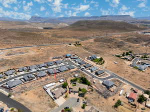 Aerial view of property's location featuring mountains and nearby suburban area