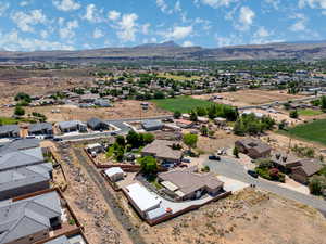 Aerial perspective of suburban area with a mountainous background