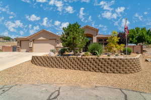 Mediterranean / spanish-style home featuring stucco siding, concrete driveway, a tiled roof, and an attached garage