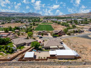 View from above of property with a mountain backdrop