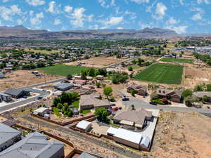 Aerial perspective of suburban area with a mountainous background