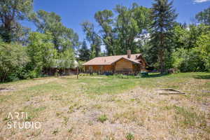 View of yard with view of wooded area