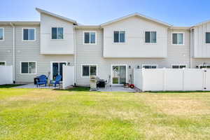 Rear view of house featuring a patio