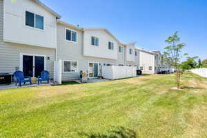 Rear view of house featuring a patio